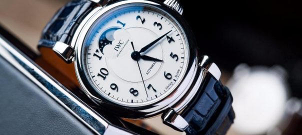 The stainless steel copy watch has a white dial.